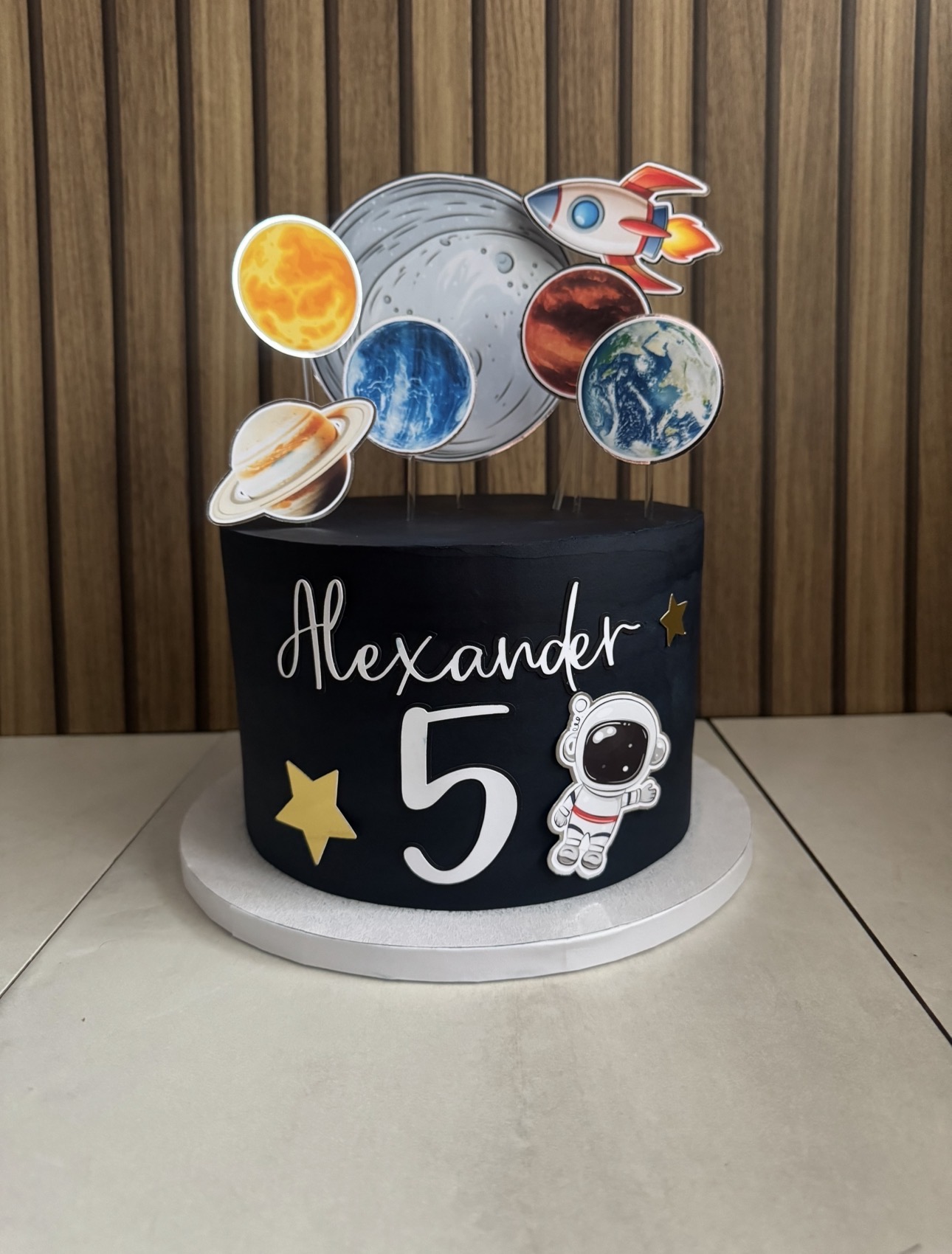 Space themed birthday cake with planets