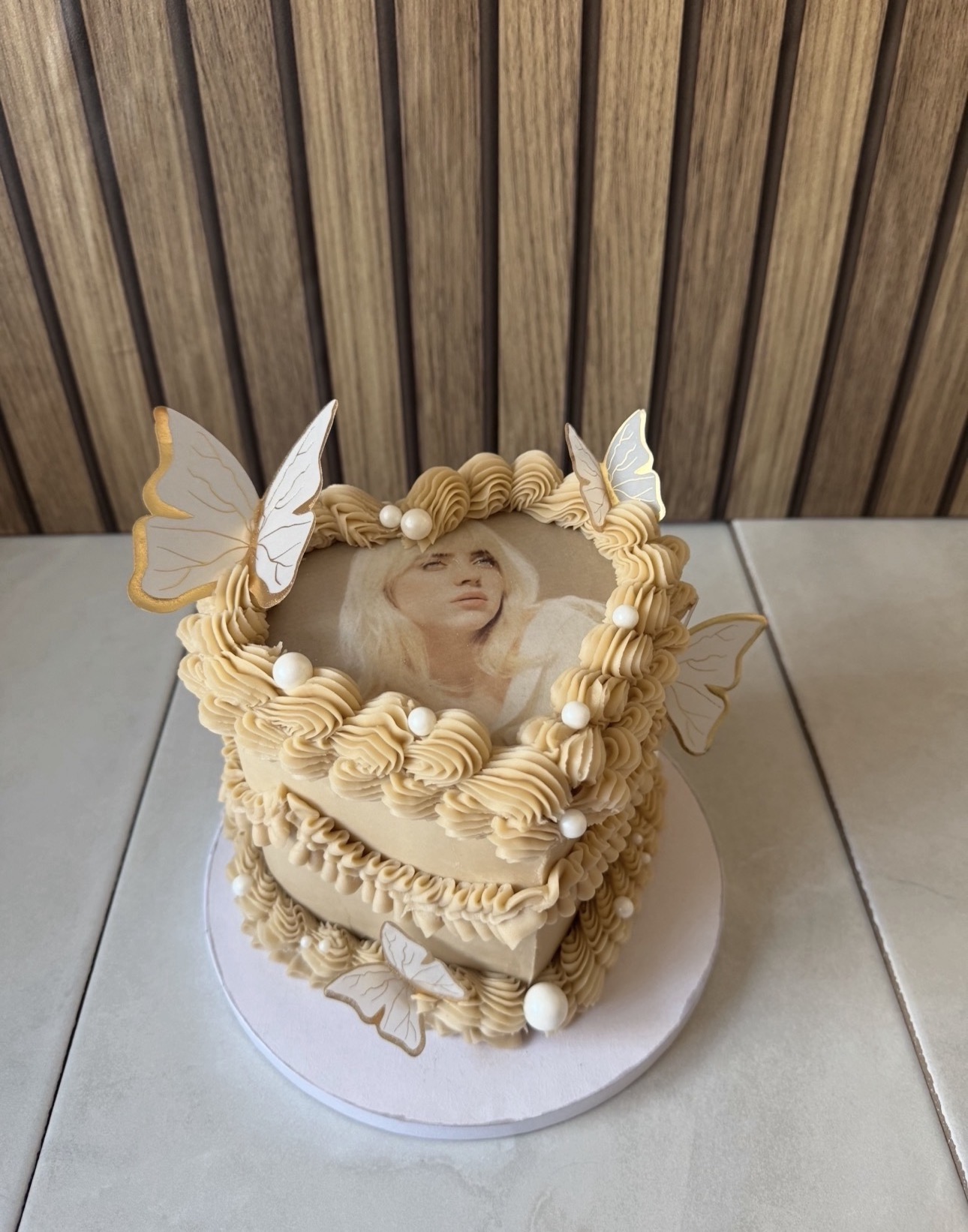Vintage buttercream cake with edible image and butterflies