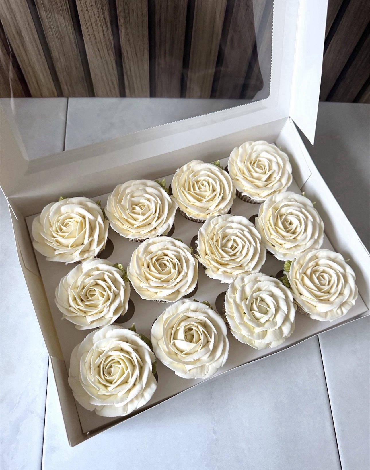 Box of buttercream rose cupcakes