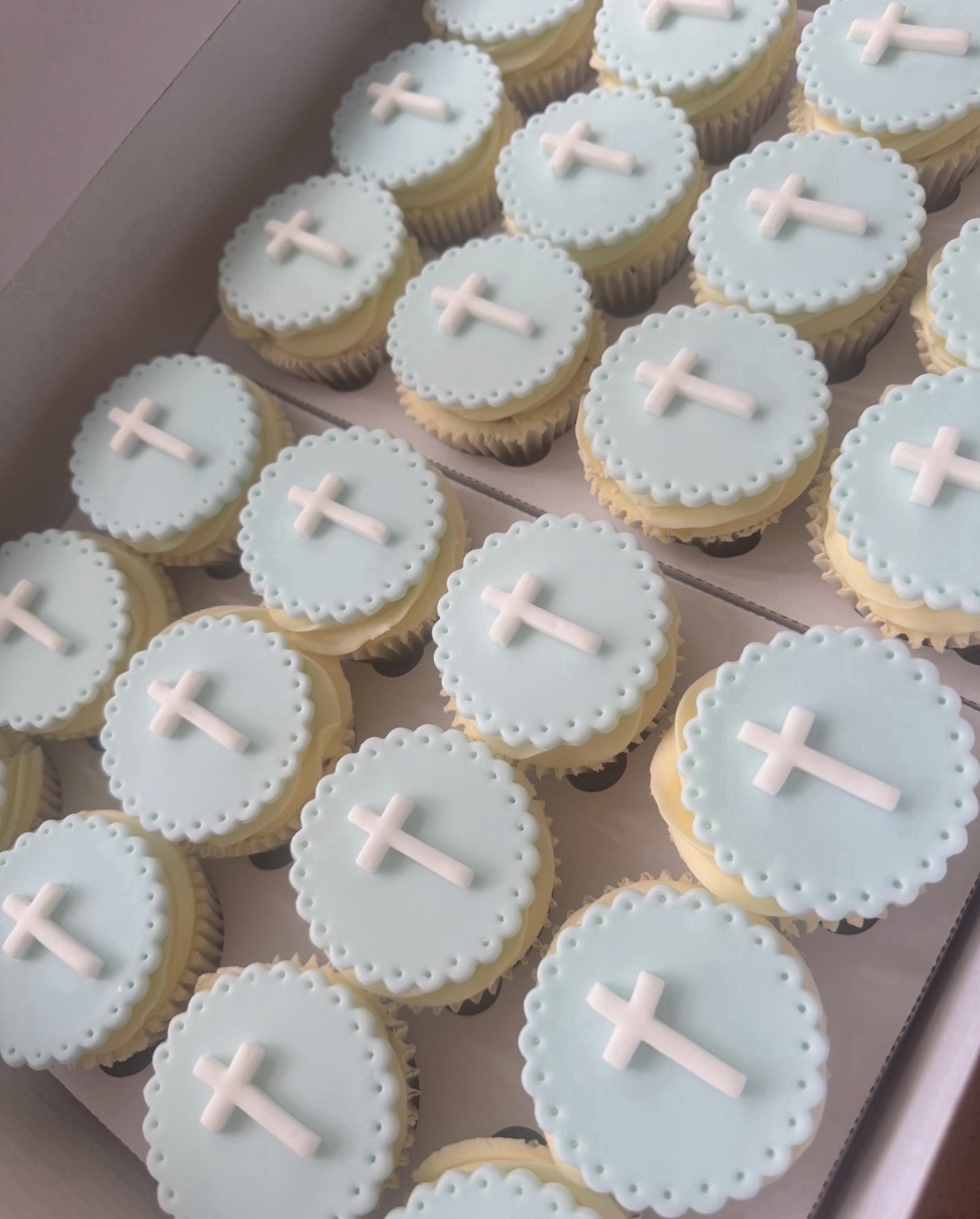 Christening cupcakes with cross toppers