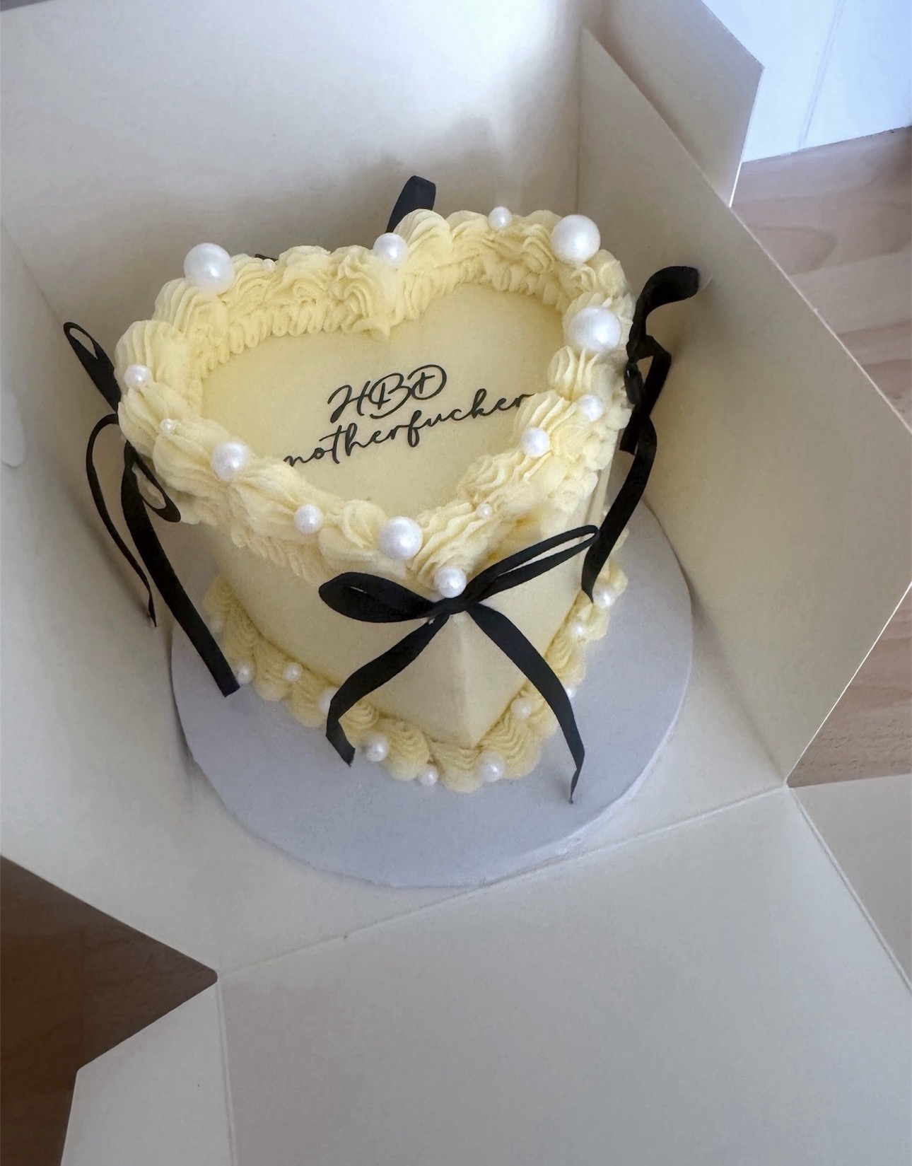Vintage heart cake with pearls and black bows
