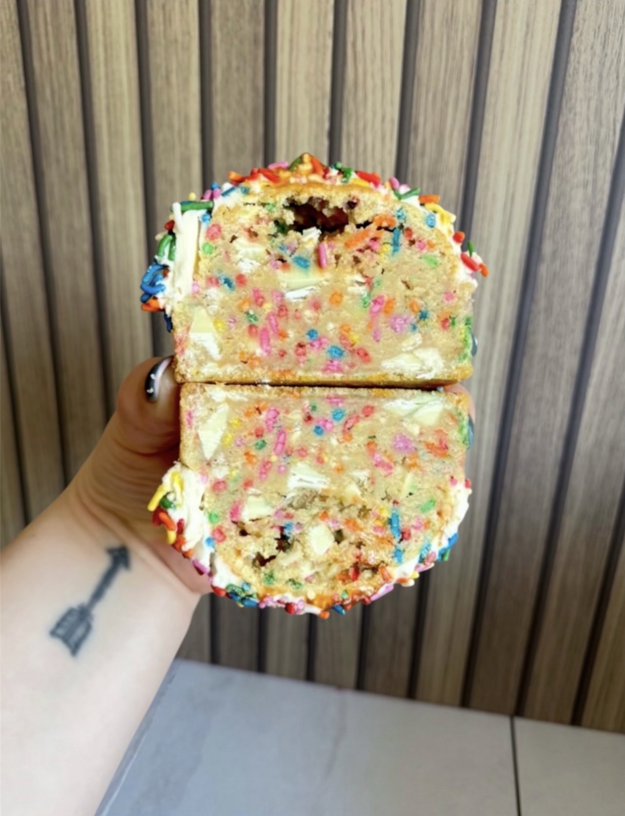 Funfetti sprinkle stuffed cookie cut open